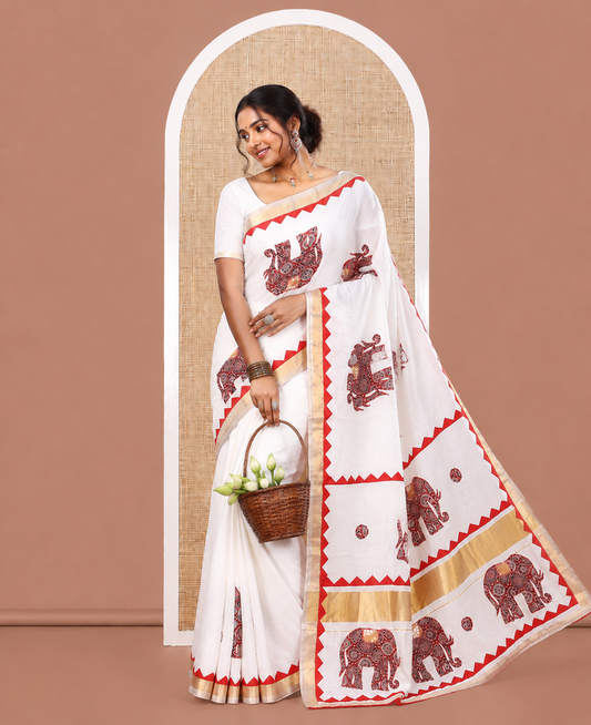 Cream Kerala Cotton Saree Features Elephant Patchwork, a Contrast Temple Border, and a Plain Blouse