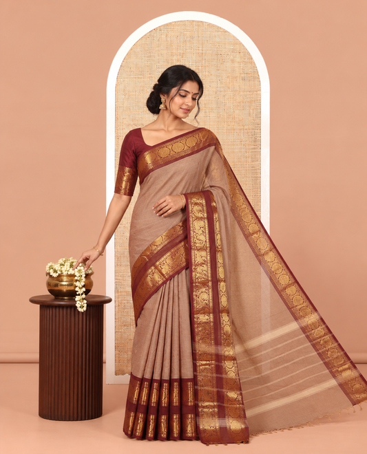 Brown Plain Chettinad Cotton Saree, Complemented by a Contrast Peacock-Chakram Rettai Pettu Border, and a Matching Blouse