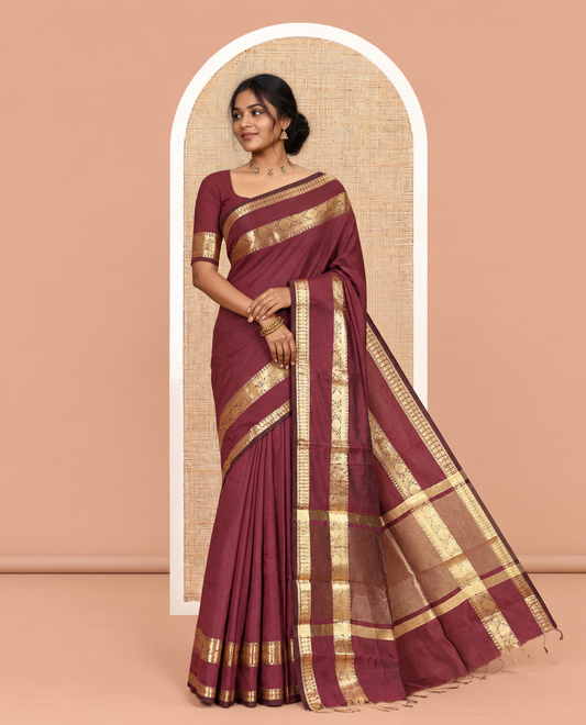 Purple Plain Semi-Katan Silk Saree, Highlighted by a Traditional Zari Border, Intricate Pallu, a Matching Blouse