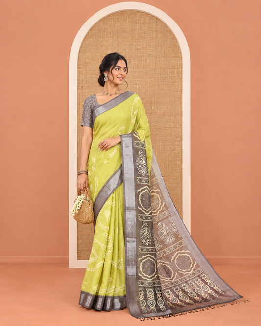 Green Linen Cotton Saree, Adorned with Shibori Printed on Its Body, Complemented by a Contrast Bavanji Zari Border, Handblock Printed Pallu, and Paired with a Contrast Blouse