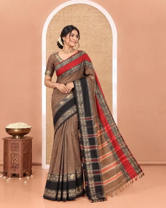 Chikku Plain Mercerised Cotton Saree, Complemented by a Contrast Ganga-Jamuna Rettai Pettu Thread Border of Temple, Elephant, and Chakram Designs, Subtly Striped Pallu, and Paired with a Matching Blouse