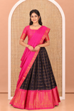 Navy Blue-Rani Pink Sungudi Cotton Half-Saree Features Checked Skirt, Contrast Gopuram Border, Contrast Blouse, and Zari-Bordered Syska Georgette Dhavani