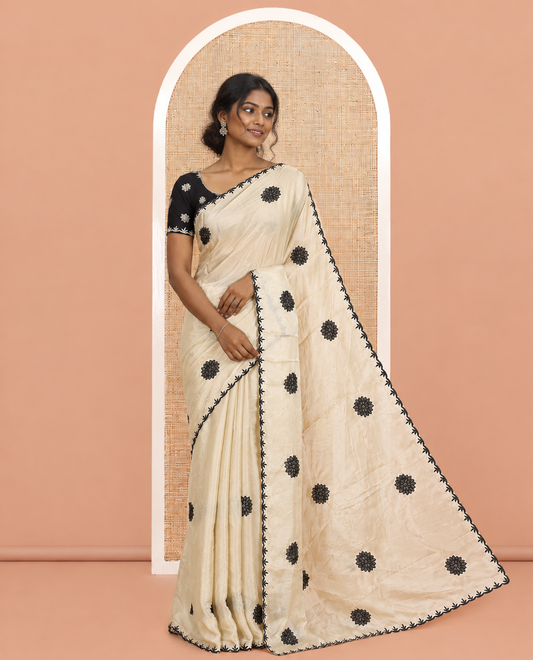 Chikku Chiffon Saree, Gracefully Embellished with Floral Embroidery Buttas, a Lace Embroidered Border, a Contrast Blouse