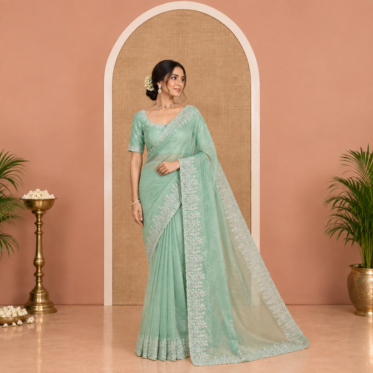 Green Twill Net Saree, Gleamed Up with Stone Work, Highlighted by a Scallop Embroidered Border, and Paired with a Matching Blouse
