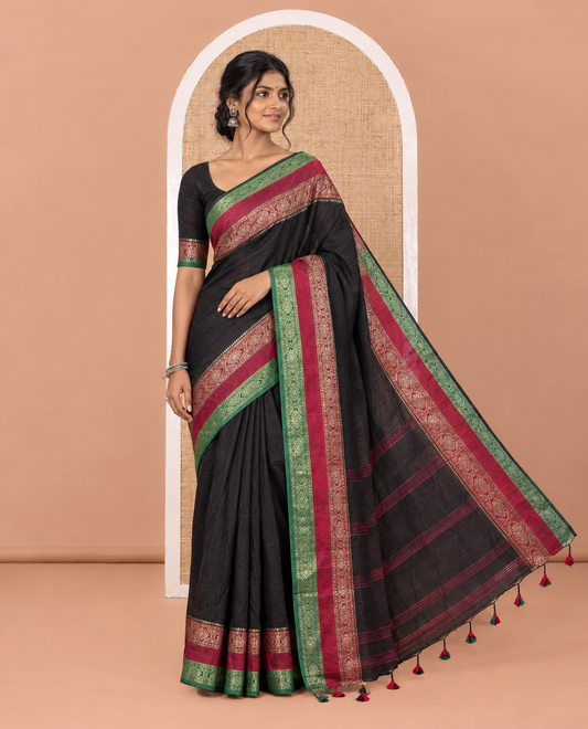 Black Plain Khadi Mul Cotton Saree, Complemented by Contrast Rettai Pettu Diamond Patterns Zari Border, Subtly Striped Pallu, and Paired with a Matching Blouse