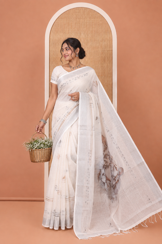Cream Linen Cotton Saree, Subtly Sparkled with Ikkat-Style Print on Its Body, a Subtle Zari Border, Pallu of Big Tiger Picture Print, and Paired with a Matching Blouse
