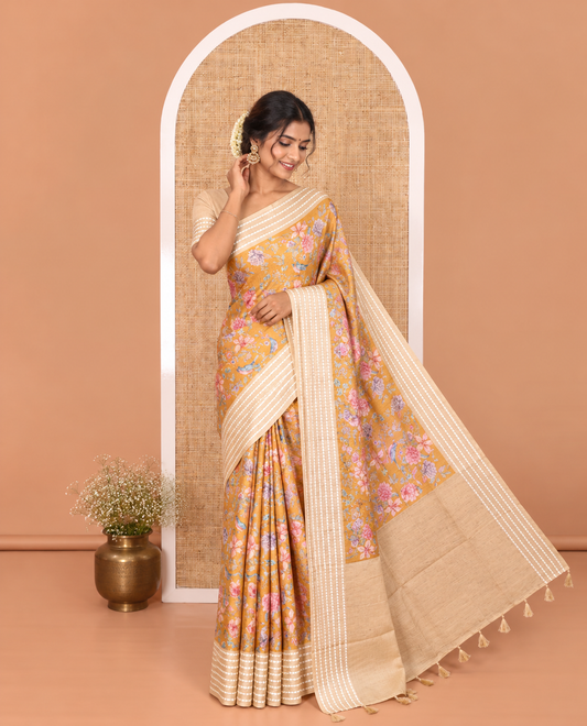 Mustard colorful floral motifs printed fancy tussar saree, contrast triangle motifs border, striped pallu, and a contrast striped blouse