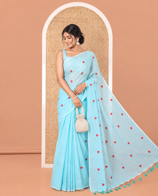 Borderless Sky Blue Khadi Mul Cotton Saree, Artfully Designed with Heart Motifs Embroidery Across Its Body, Pallu mirrors the Same Design, and Paired with a Matching Blouse