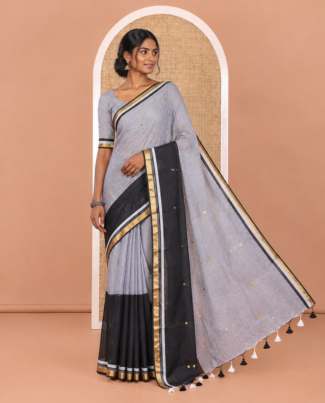 Grey and Black Khadi Mul Cotton Saree, Beautifully Bedecked with Double-Color Half-And-Half-Style Jamki Work, Complemented by Contrast Zari Border, and Paired with a Matching Blouse