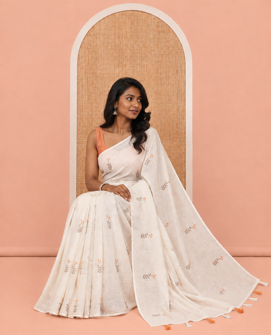 Borderless Cream-Orange Linen Cotton Saree, Prettified with Floral Buttas, a Self-Pallu, and a Contrast Blouse