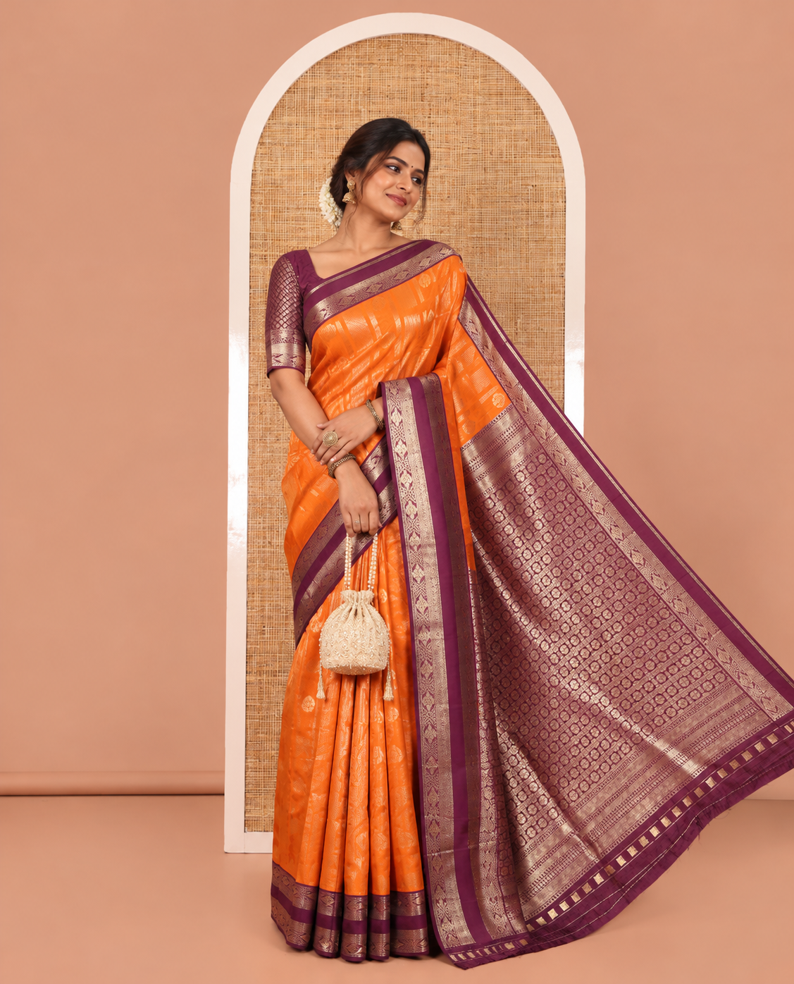 Orange Litchi Saree, Detailed with Vaira Oosi Stripes and Zari Buttas on Its Body, Complemented by a Contrast Rettai Pettu Traditional Zari Design Border, an Intricately Designed Pallu, and Paired with a Contrast Blouse
