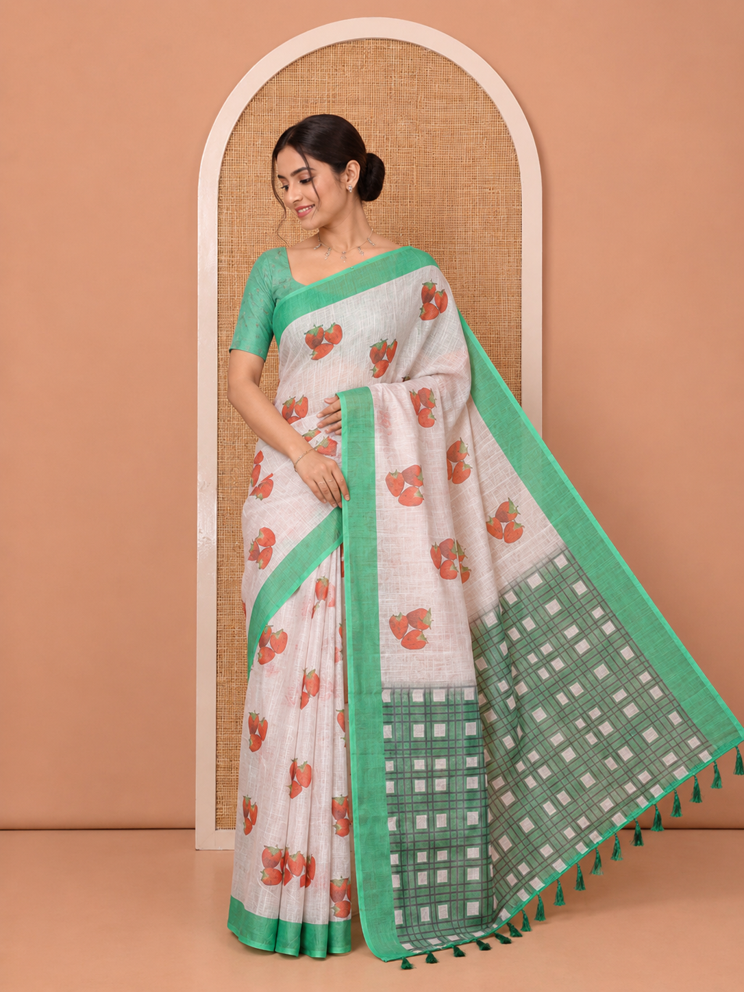 Cream Linen Cotton Saree, Artfully Printed with Stawberry Motifs All Over Its Body, Complemented by a Contrast Border, Checked Design-Printed Pallu, and Paired with a Contrast Blouse