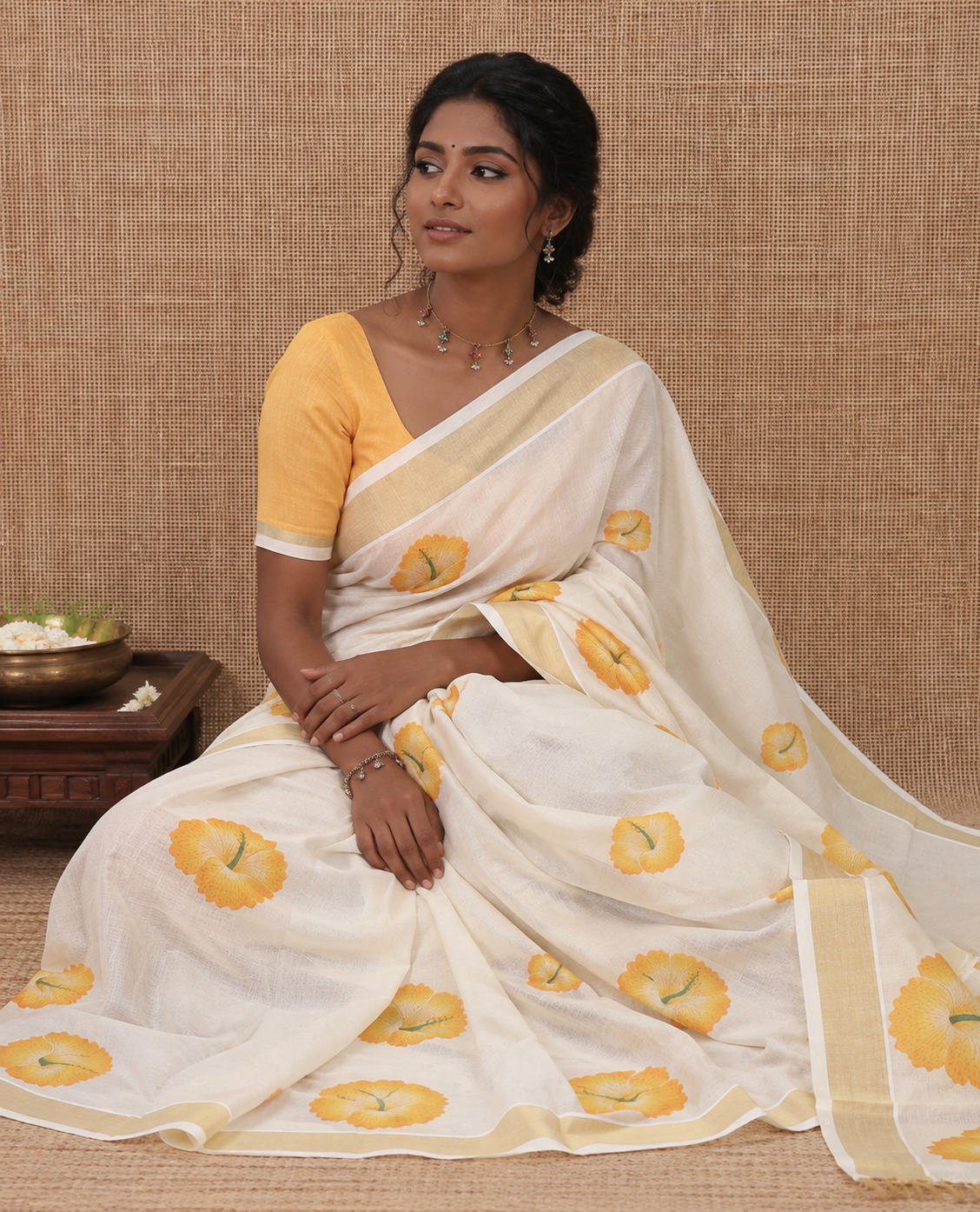 Cream Kerala Cotton Saree, Beautified with Hibiscus Motifs, a Zari Border, Hibiscus Pallu, and a Contrast Blouse