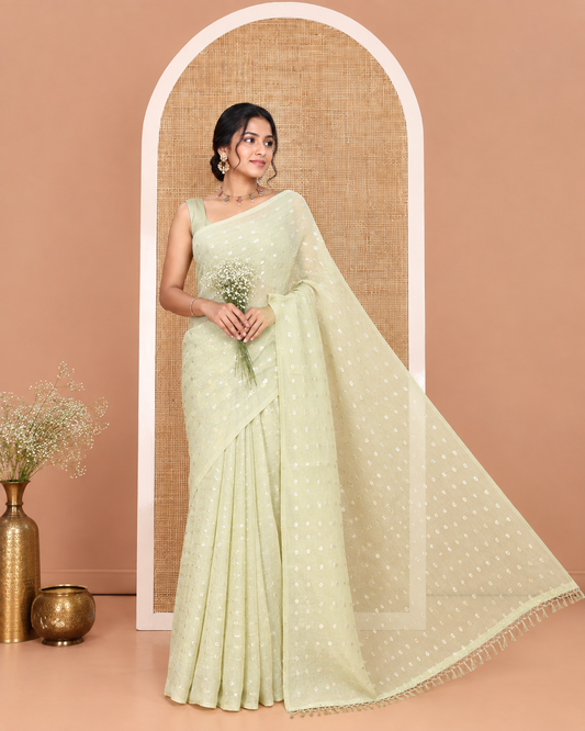 Borderless Pale Green Shimmer Saree, Detailed with Zari Buttas All Over Its Body, Pallu Mirrors the Same Buttas, and Comes Without a Blouse