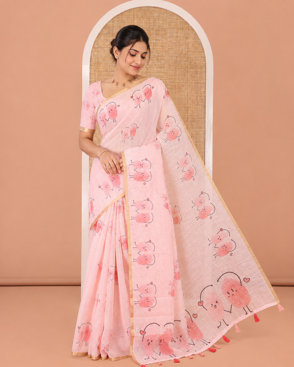 Peach Linen Cotton Saree, Creatively Printed with Thumb Finger Printed Cartoon-Theme Print on Its Body, a Subtle Piping Border, a Self-Printed Pallu, and Paired with a Matching Blouse