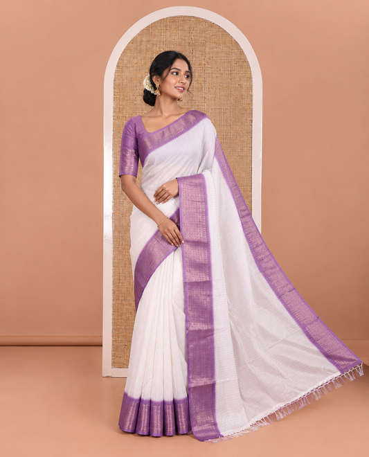 White and Lavender Dola Silk Saree Adorned with Vertical Zari Stripes All Over the Body, Complemented by a Contrast Border of Traditional Zari Designs, Self-Pallu of Stripes, and Paired with a Contrast Blouse