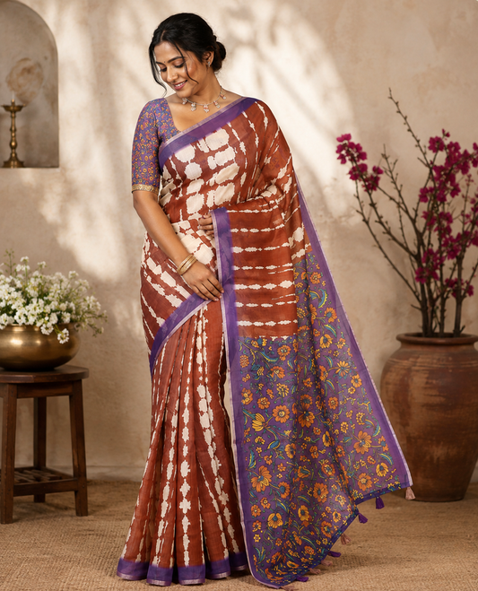 Coffee Brown Mercerised Cotton Saree, Adorned with Shibori Printed on Its Body, Complemented by a Contrast Border, Pallu Steeped with Colorful Floral Print, and Paired with a Contrast Printed Blouse