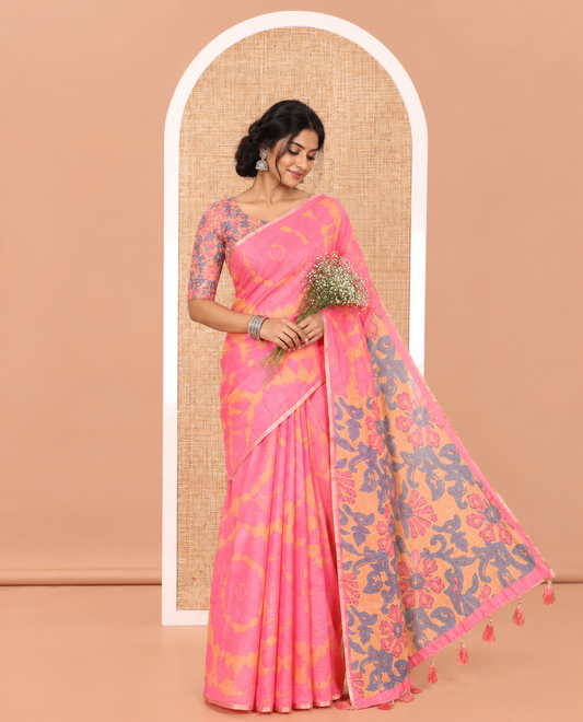 Pink Linen Cotton Saree, Ornamented with Shibori Printed on Its Body, Subtle Piping Border, Pallu Features Floral Print, and Paired with a Contrast Floral Printed Blouse