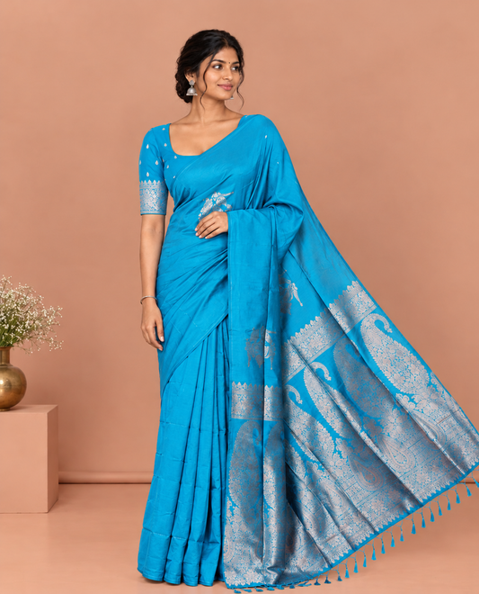 Borderless Peacock Blue Kanchi Silk Saree, Opulently Embellished with Zari Buttas, Intricate Pallu, and a Matching Blouse