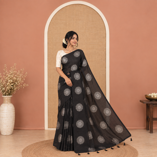 Borderless Black Vichitra Saree Features Rangoli-Style Round Buttas Foil Print and a Contrast Sequins Embroidered Blouse