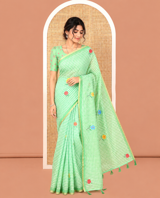 Green Linen Cotton Saree, Elevated with Micro-Checks and Floral Motifs on Its Body, Subtle Piping Border, a Self-Pallu, and Paired with a Rose Floral Printed Blouse