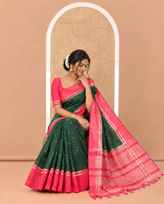 Bottle Green Assam Silk Saree, Accentuated with Zari Buttas on Its Body, Complemented by Contrast Zari Striped Border, Pallu Steeped with Gleaming Zari Stripes and Buttas, and Paired with a Contrast Blouse