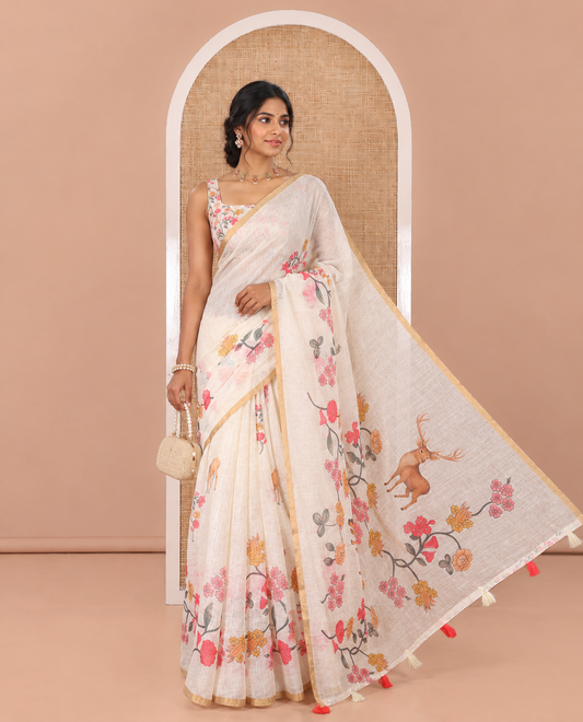 Cream Linen Cotton Saree, Adorned with Floral Vine and Deer Motifs All Over Its Body, Subtle Piping Border, a Self-Pallu, and Paired with a Matching Blouse