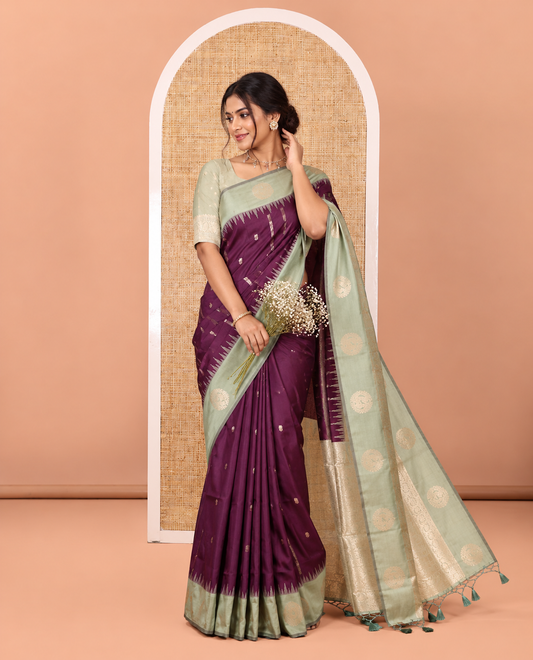 Purple Elite Soft Silk Saree, Elevated with Zari Buttas and Zari Stripes All Over Its Body, Complemented by a Contrast Temple Border of Round Peacock Designs, Rich Pallu of Peacock Chakram Butta Enclosed Checks, and Paired with a Contrast Blouse