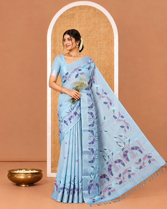 Sea Blue Linen Cotton Saree, Elevated with Jamdani-Style Lotus Designs Printed All Over Its Body, Zari Tissue Border, Pallu Mirrors the Same Print, and Paired with a Matching Blouse
