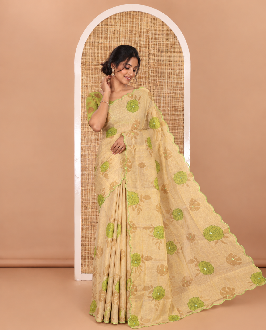 Gold and green rose motifs printed with mirror work tissue saree, scallop embroidered border, printed pallu, and a contrast blouse