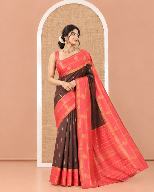 Brown and Red Kanchi Silk Saree, Accentuated with Zari Buttas All Over Its Body, Complemented by a Contrast Border of Paisleys, Zari-Striped Pallu, and Paired with a Contrast Jacquard Blouse