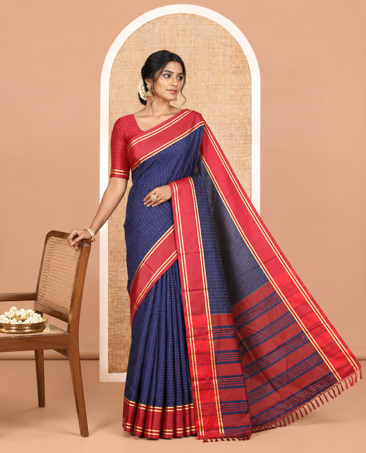 Navy Semi-Soft Silk Saree Steeped with Plus-Shaped Buttas, Contrast Border, and a Matching Blouse