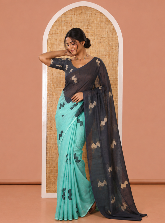 Borderless Green Linen Cotton Saree, Elegantly Printed with Zig-Zag Geometric Motifs, Pallu Mirrors the Same Motifs, and Paired with a Contrast-Printed Blouse