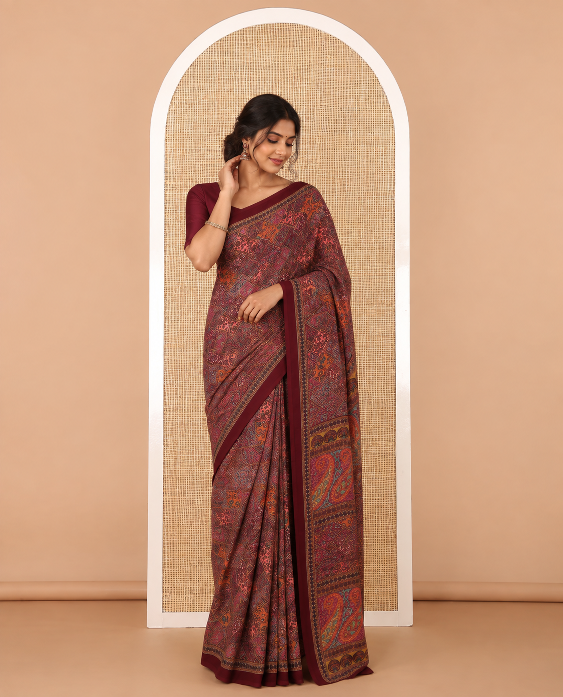 Maroon kaleidoscopic-colored checks mill-printed kimaya saree, contrast plain border & paisley & geometric printed pallu