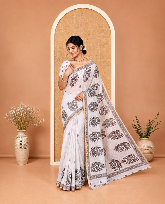 Cream Linen Cotton Saree, Decked Up with Floral-Paisley Motifs Print All Over Its Body, Highlighted by Gold Zari Printed Border, Floral-Paisley Printed Pallu and Paired with a Matching Blouse
