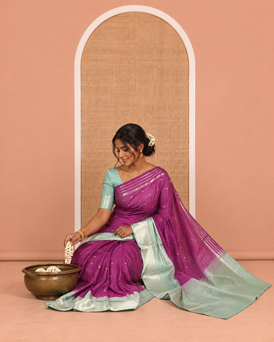 Violet Art Crepe Saree Features Zari Buttas, Complemented by Contrast Traditional Zari Border, Zari Striped Pallu, and a Contrast Blouse