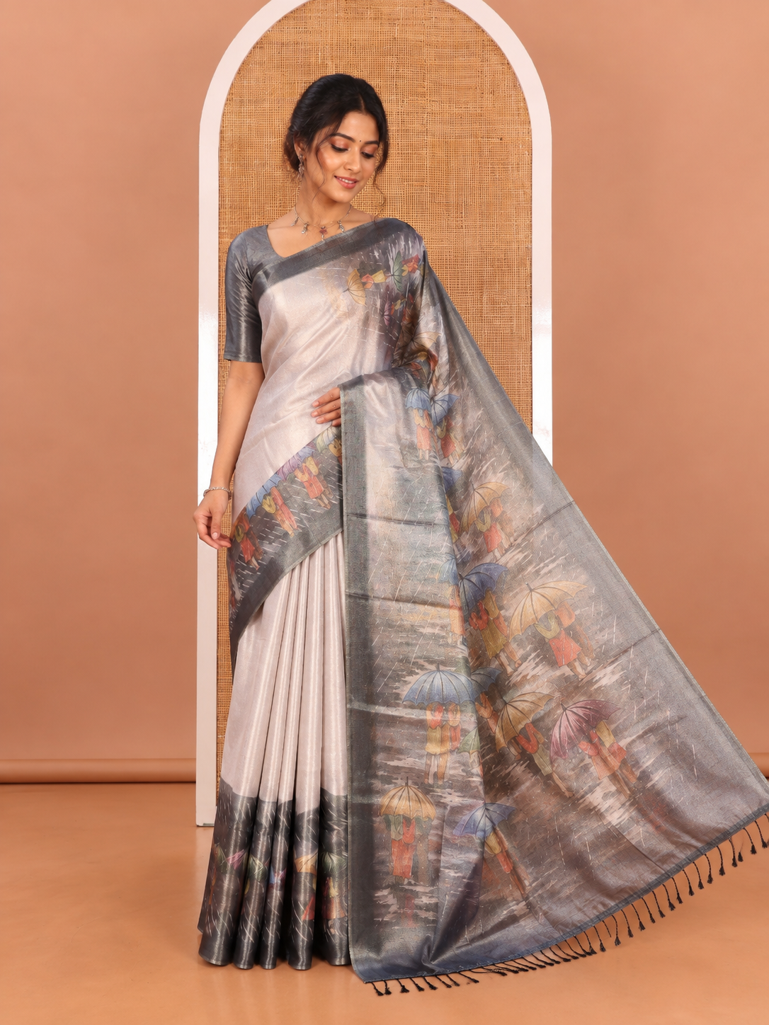 Gold Rain-Themed Printed Tissue Saree Features People with Umbrellas, a Contrast Zari Border, and a Matching Blouse