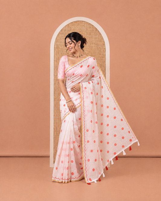 White Linen Cotton Saree, Beautified with Polka Dots All Over Its Body, Subtle Piping Border, Self-Pallu, and Paired with a Floral Printed Matching Blouse