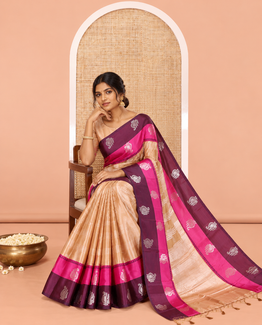 Gold Warm Silk Saree, Majestically Detailed with Zari Buttas and Zari Checks on Its Body, Complemented by a Contrast Temple Border of Unique Designs, Intricately Designed Pallu, and Paired with a Matching Blouse