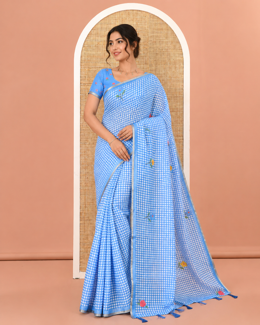 Blue Linen Cotton Saree, Decorated with Micro-Checks and Floral Motifs on Its Body, Subtle Piping Border, a Self-Pallu, and Paired with a Rose Floral Printed Blouse