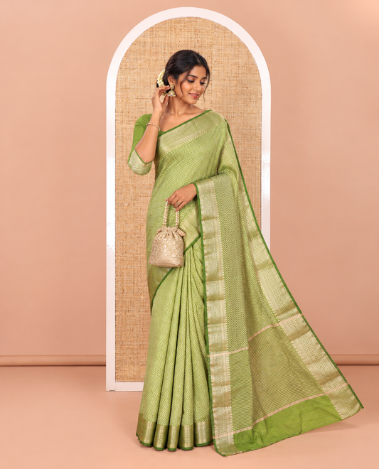 Green Semi-Tussar Saree Accentuated with Zig-Zag Strips Prints, Featuring a Self-border with Traditional Motifs, a Zari-Striped Pallu, Paired with a Matching Blouse
