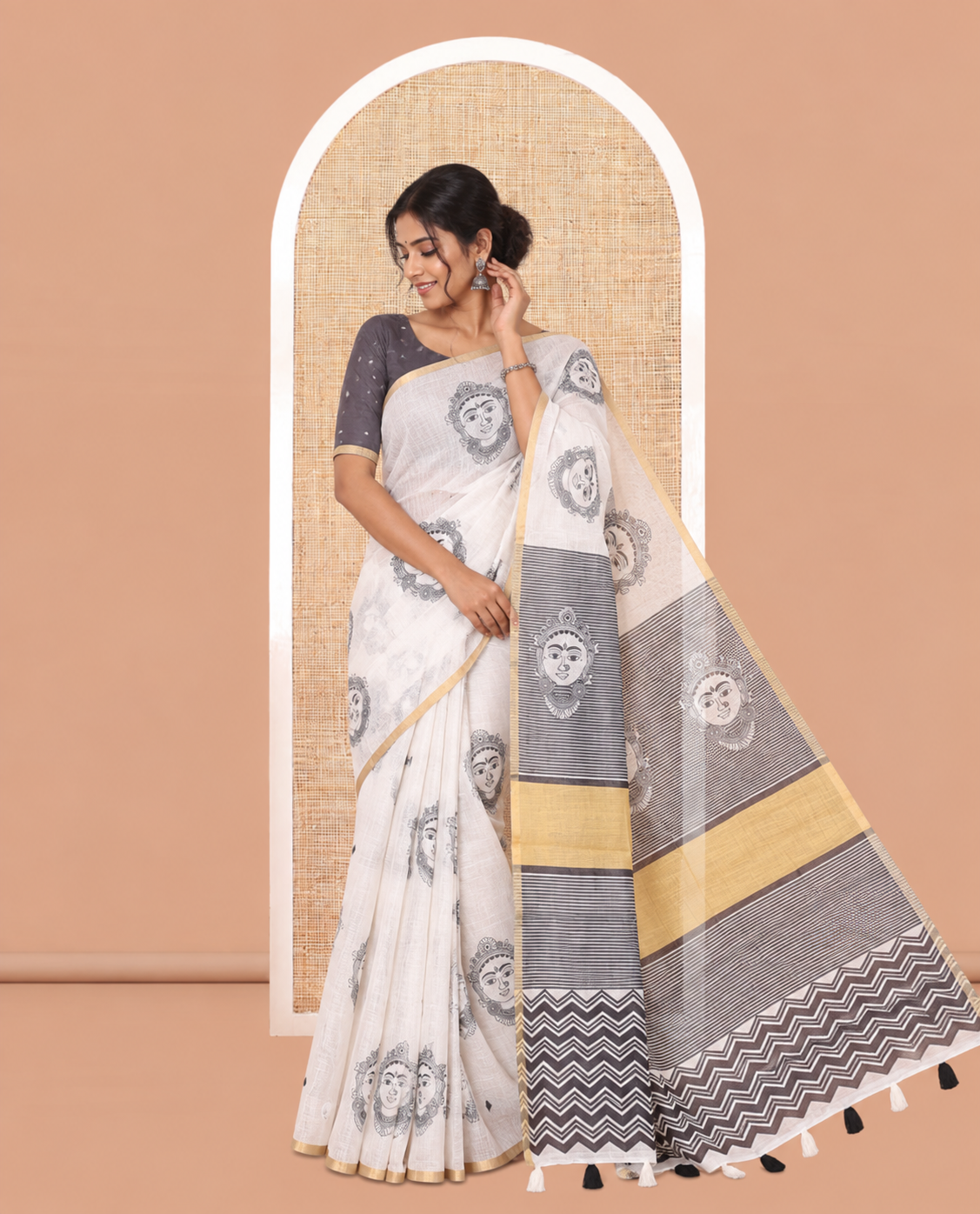 Borderless Cream Linen Cotton Saree, Adorned with Face Print, Contrast Pallu of Chevron Stripes and Face Print, a Contrast Blouse