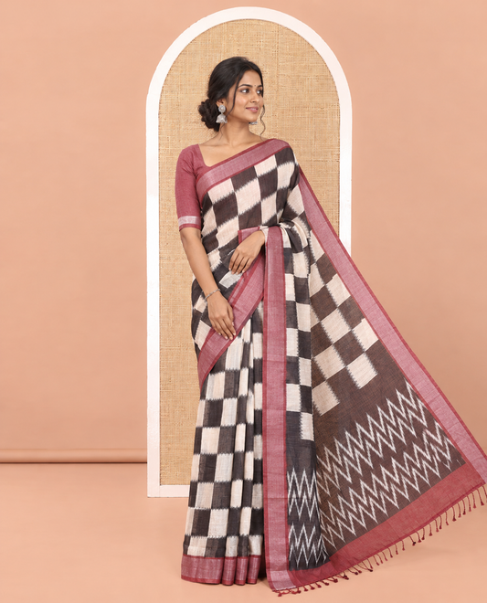 Black and White Linen Cotton Saree With Chess-Style Checked Design on Its Body, Complemented by a Contrast Zari Border, Chevron Design Pallu, and Contrast Blouse