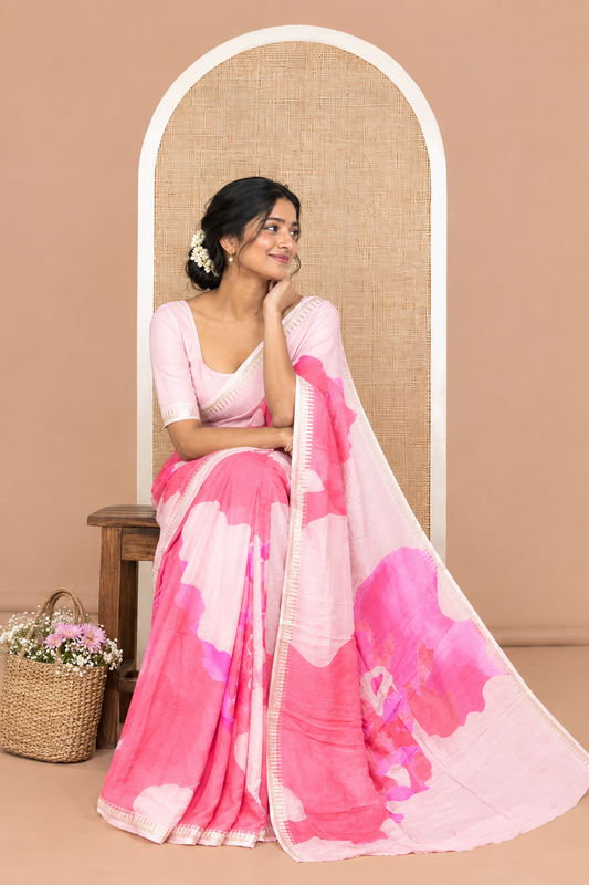 Dusky Pink Moss Chiffon Saree Features an Abstract Print, a Gold Zari Border, Printed Pallu, and Matching Blouse