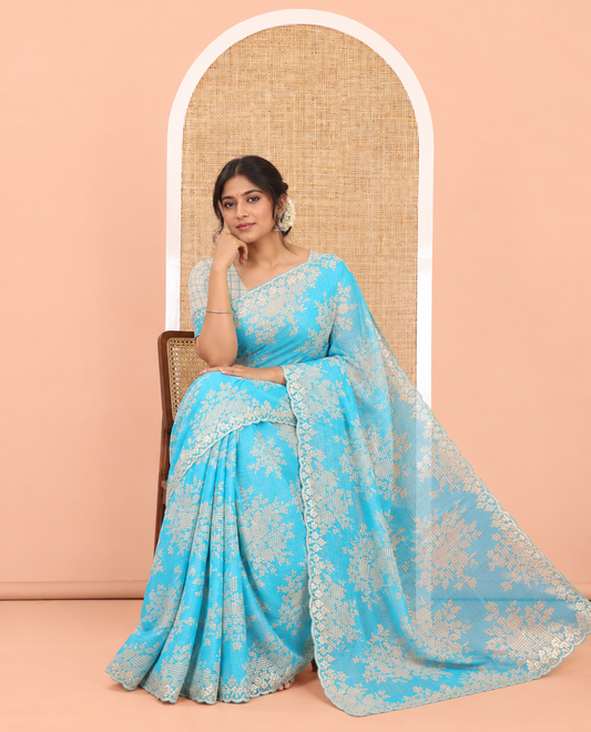Blue Chiffon Saree Features Abstract Print, a Scallop Sequins Work Border, and Contrast Blouse