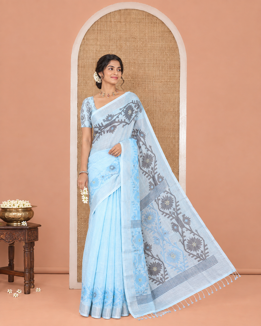 Blue Plain Linen Cotton Saree, Subtly Sparkled Zari Border of Jamdani-Style Leaf-Floral Designs, Pallu Depicting Jamdani-Style Designs, and Paired with a Matching Blouse