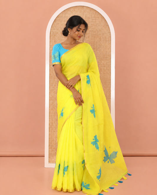 Yellow Linen Cotton Saree, Beautified with Butterfly Buttas All Over Its Body, Subtle Piping Border, Pallu of Butterfly Print, and Paired with a Contrast Fairy Motifs Printed Blouse