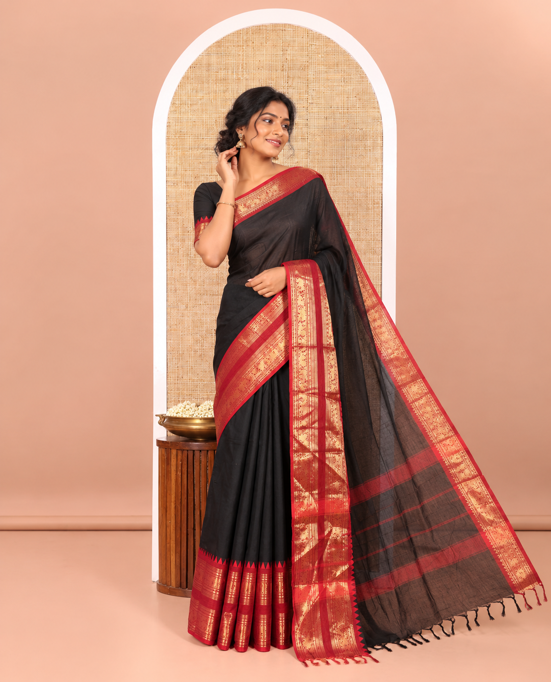 Black Plain Chettinad Cotton Saree Elevated with a Contrasting Temple Rettai Pettu Border of Peacock-Elephant Motifs, a Subtle Pallu of Stripes, and a Matching Blouse