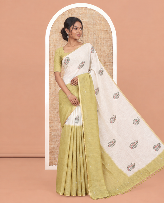 Cream-Green Linen Cotton Saree Features a Half-And-Half-Style Floral Butta and Mirror Work, a Piping Border, a Contrast Blouse