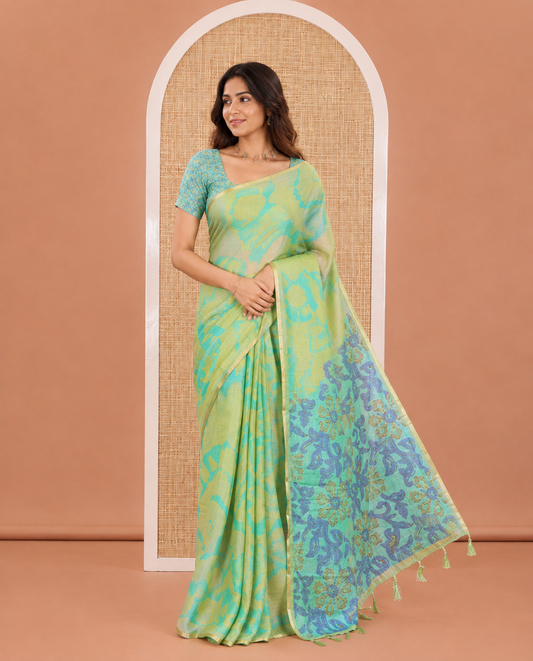 Light Green Semi-Cotton Saree, Accentuated with Shibori Printed on Its Body, Subtle Piping Border, Pallu Features Floral Print, and Paired with a Contrast Floral Printed Blouse